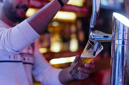 Pouring a beer at the tap